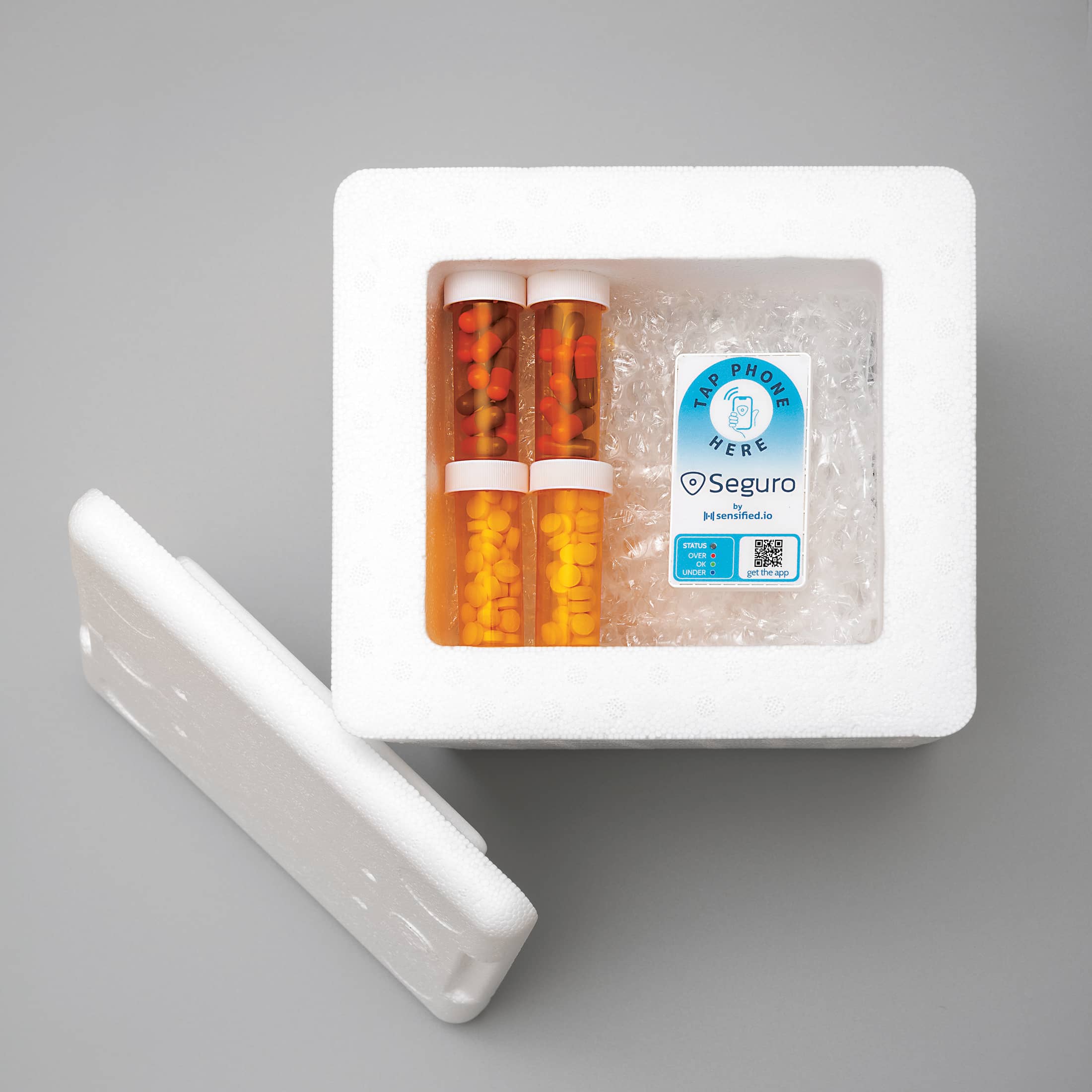 indoor sitting refrigerator table laying remote holding