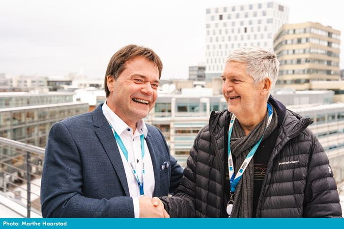 Handshake between new Nordic CEO, Vegard Wollan and former CEO, Svenn-Tore Larsen